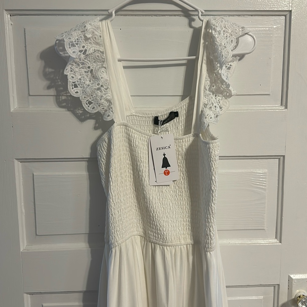 White dress with lace features.